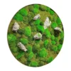 Circular wall art made of textured green moss and decorative grey stones.