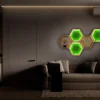 Illuminated hexagon wooden wall shelves with glowing green moss art mounted above a sofa in a modern living room