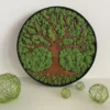 Round decorative tree moss wall art featuring tree silhouette and preserved moss in a circular frame