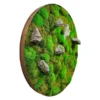 Round wooden-framed moss wall art featuring textured green moss and protruding gray rocks.