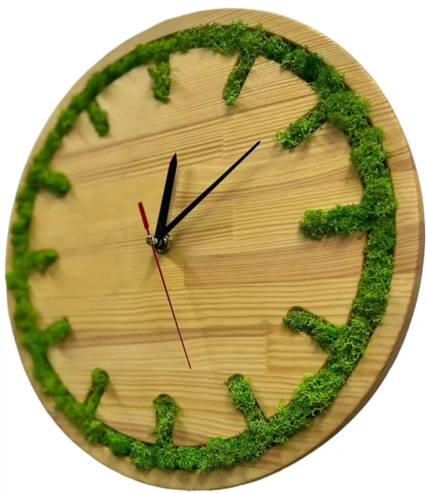 Round wooden wall clock with green moss inlay along the rim and hour markers, black hands, and a red second hand.