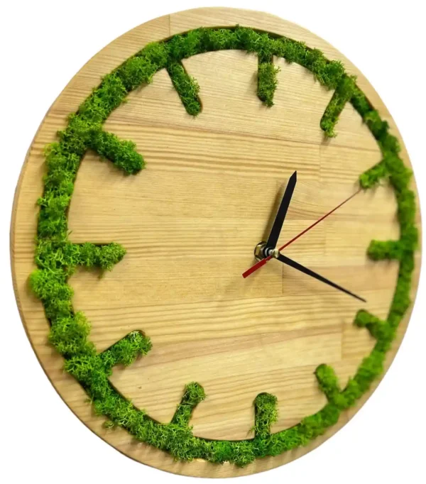 Round wooden wall clock with green moss inlaid along the outer rim to mark the hours, with black and red hands.