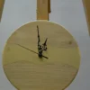 Round pale wood wall clock with light epoxy resin river and vintage-style black hands on wooden easel (9" / 23 cm)