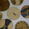 Assorted 9-inch (23 cm) solid wood wall clocks with epoxy resin inlays and hour markers