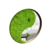Angled view of round yin-yang mirror with green reindeer moss and ball moss in a natural wood frame