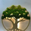 Round wooden tree wall art with layered green preserved moss canopy and warm yellow backlighting