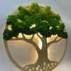 Round natural wood tree wall art featuring green preserved moss foliage and warm yellow backlighting.