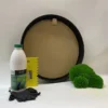 Round black frame DIY kit with moss glue bottle, yellow spreader, black gloves, and green ball moss