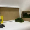 DIY moss wall art kit with white rectangular frame, boxed preserved moss, adhesive, glue spreader, and gloves