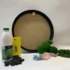 Round black wood frame kit with assorted green moss, colorful dried flowers, craft glue, spreader, and gloves.