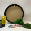 Round wall art frame with DIY moss kit supplies including preserved moss, dried flowers, glue, and application tools.