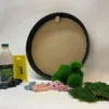 DIY round black frame moss kit with dried flowers, green moss bunches, glue bottle, spreader, and gloves.