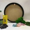 DIY craft kit featuring round black frame, preserved moss balls, flat moss, dried flowers, glue bottle, gloves, and scraper