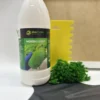 Ekomoss moss glue bottle beside a yellow notched adhesive spreader, green moss, and a black protective glove.