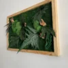 Side view of rectangular moss wall art with textured green ferns and natural wood details in a pine frame.