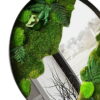 Round black frame mirror decorated with green moss and faux fern foliage