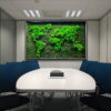 meeting-room-map3.-3.jpg Framed green moss world map wall art on office meeting room wall above white table with blue chairs.