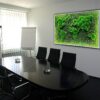 meeting-room-map5.-1.jpg Illuminated green moss world map wall art with black frame, mounted on office conference room wall