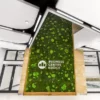 Green ball and flat moss wall with Business Centre Košice signage in a modern building lobby.