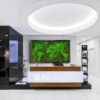 office-map1.jpg Framed moss world map wall art displayed behind a modern office reception desk
