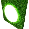 Angled view of a square green moss panel featuring a round illuminated mirror opening on a white background.