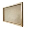 Side view of an empty rectangular natural wood frame with a deep recessed backing board.