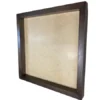 Angled view of empty square dark brown wooden shadow box frame with deep edges and backboard