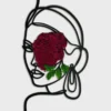 Woman silhouette line art wall hanging with preserved reindeer moss accent on a neutral background