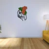 Woman face line art with pink and green moss mounted on a white living room wall beside a yellow sofa and floor lamp.