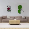 Black line art moss wall decor displayed above a brown sofa in a modern minimalist living room