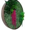 Angled view of round wood frame showing depth, textured green reindeer moss, and hanging pink foliage