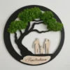 Round family tree wall art with preserved moss foliage, silhouette figures, and an engraved personalized plaque