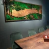Large framed moss wall art with a natural wood slab hung above a dining room table