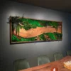 Moss wall art with live-edge wood slab displayed above a dining table in a dining room