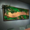 Preserved green moss, ferns, and live-edge wood slab set inside a rectangular wooden frame