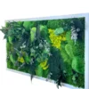 Side view of rectangular preserved moss and plant wall art with 3D ferns and foliage in a white wooden frame.