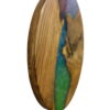Side view of round wood wall clock highlighting smooth curved edge and glossy blue and green epoxy resin inlay.