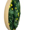 Side view of round moss wall art in a natural wood frame with preserved green foliage and small yellow flowers.