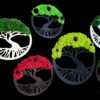 Round Tree of Life moss wall art with green and red reindeer moss in black, white, and brown wooden frames.