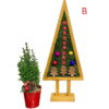 Natural wood triangular moss Christmas tree with red stars and colorful baubles on a stand next to potted pine