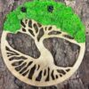 Light wood tree of life wall decor with green reindeer moss canopy and pinecones, displayed on tree bark.