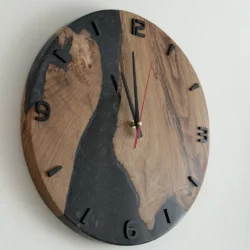 Black Wood and Epoxy Wall Clock with black numbers and red second hand, side view
