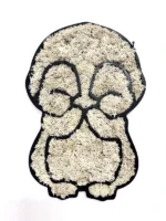 Penguin wall decor with a black frame, filled with light preserved moss against a white background.