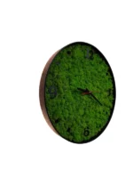Moss wall clock with green Iceland moss, dark wood frame, and black numerals, side view from left