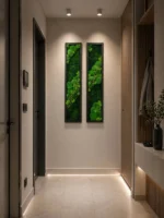 Two narrow, vertical moss wall art pieces with green moss and branches on a hallway wall with warm lighting