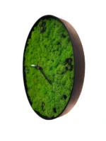 Moss wall clock with green Iceland moss, dark wood frame, and black numerals, side view from right